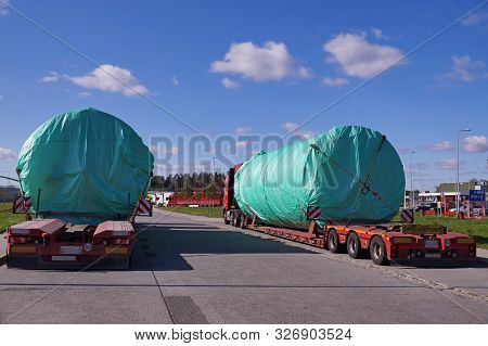 A Truck With A Special Semi-trailer For Transporting Oversized Loads.  Oversize Load Or Exceptional 