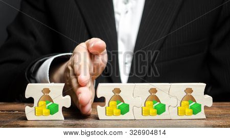 A Businessman Separates Part Of The Money From The Total. Payment Of Taxes And Deductions. Corruptio