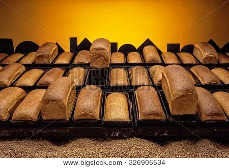 Freshly Baked Bread Loaves Rising Out Of Their Moulds Ready To Go Out Into The City At Sunrise