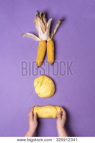 Home Baking Cornbread With Woman Hands Handling Corn Flour Dough Over A Purple Tabletop. Above View 