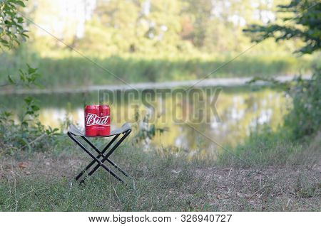 Sumy, Ukraine - August 10, 2019: Budweiser Bud Beer Cans Pack On Folding Chair Outdoors At The River