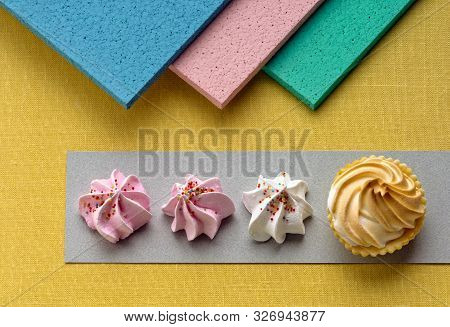 A Pic Of Three Small Meringues And One Big Meringues In A Row With A Very Colourful Background