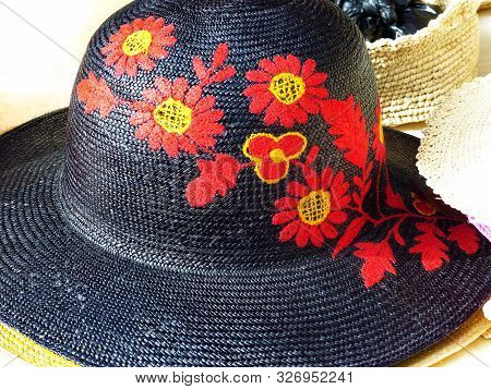Handmade Panama Hat Or Paja Toquilla Hat With Decorative Red Flowers Made From Straw At Traditional 