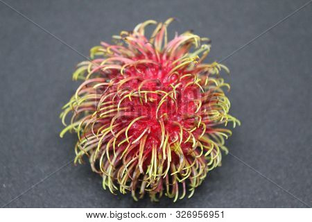 Rambutan Fruit On A Dark Grey Background