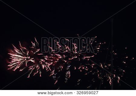 Red Fireworks Trails Painting The Night Sky