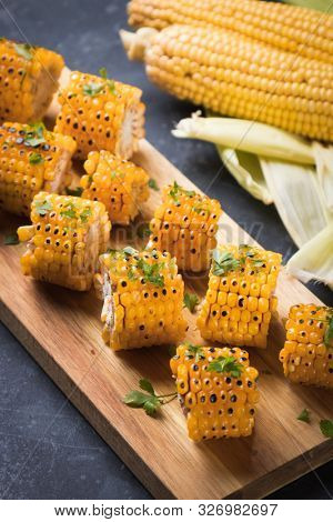 Sweet corn slices grilled and spiced as healthy party food alternative
