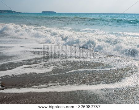 Foam And Waves In The Sea On A Sunny Day. Foam And Waves In The Sea. Powerful Waves Crushing For Bac
