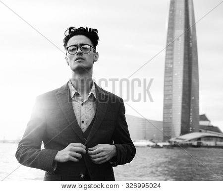 Elegant young handsome man. Symmer day. Black and white picture.