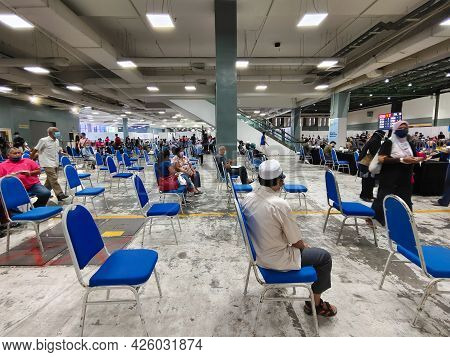 Selangor, Malaysia - July 6,2021 : Public People Can Seen Waiting Patiently In The Hall For Their Tu
