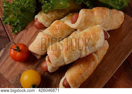 Sausage Buns. Soft Baked Bun (dough )stuffed With Pork Sausage For Fast Food Breakfast Or Coffee Bre