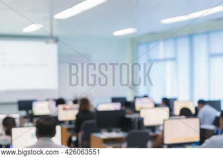 Blurred Of Teacher Groups Computer Training Technology Or Coding Application In Smartphone With Lapt