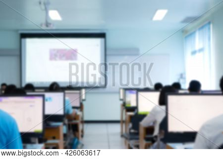 Blurred Of Teacher Groups Computer Training Technology Or Coding Application In Smartphone With Lapt