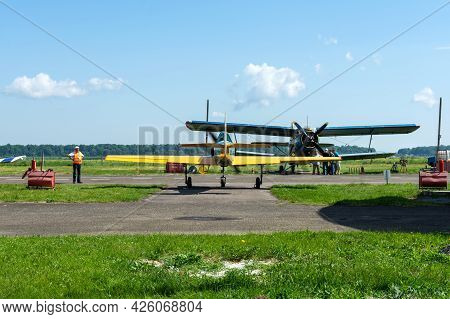 Gorodok. Ukraine. June 6, 2021. Tsuniv Airfield. Biplane, And A Training Aircraft, Parked At The Air