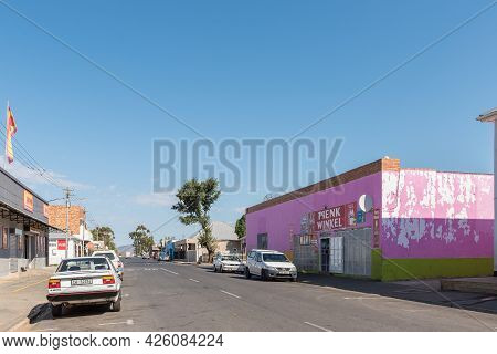 Touws River, South Africa - April 20, 2021: A Street Scene, With A Businesses, People And Vehicles, 