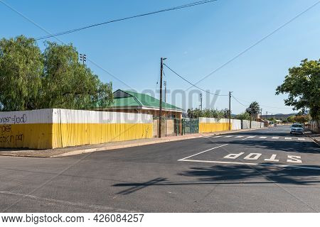 Touws River, South Africa - April 20, 2021: A Street Scene, With Public Toilets And Vehicles, In Tou