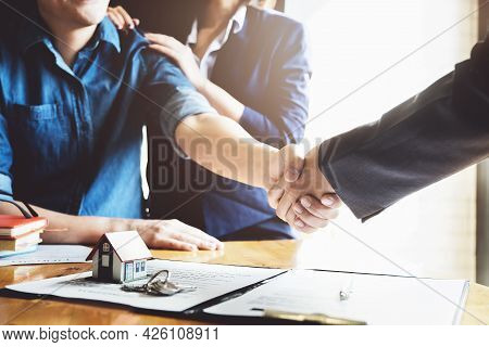 Focus On The Congratulatory Handshake. The Real Estate Agent Agrees To Buy The Home The Customer At 