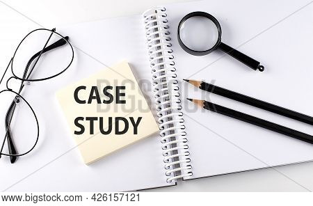 Word Case Study On The Sicker On The Notebook With Pencils,magnifier And Glasses