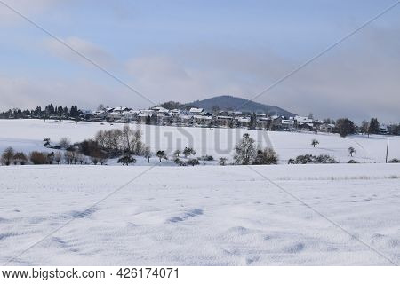 Eifel Landscape In Fresh Snow With Village Bell And Hochstein