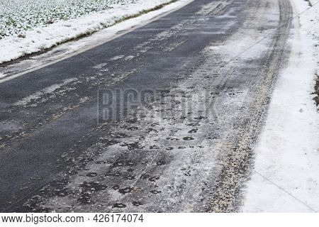 Icy Road With Snow On The Sides