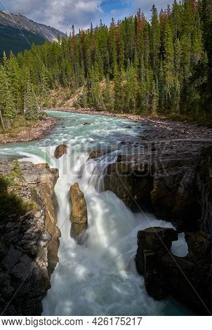 Sunwapta Falls Jasper Alberta Vertical. Water Pours Over Sunwapta Falls. Jasper National Park. Alber