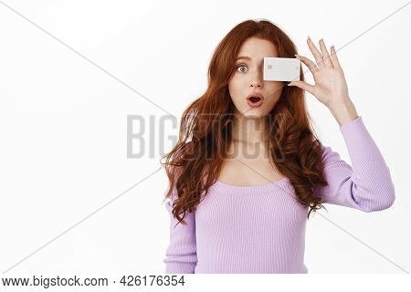 Amazed Ginger Girl Gasp And Say Wow, Show Bank Credit Card Near Eye, Advertising Shopping Promotion,