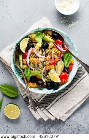 Whole Grain Pasta With Vegetables On A White Plate On A Light Grey Slate, Stone Or Concrete Backgrou