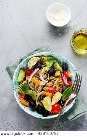 Whole Grain Pasta With Vegetables On A White Plate On A Light Grey Slate, Stone Or Concrete Backgrou