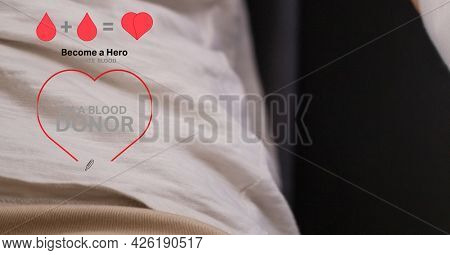 Blood donation text and icon against mid section of person donating blood at hospital. healthcare and blood donation concept
