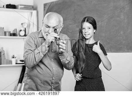 School Education. Biological Sample. Mature Teacher Look Through Magnifying Glass Tube On Lime. Smal