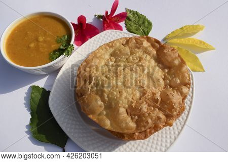 Popular Delicious Sindhi Cuisine Dish Item Dal Pakwan With Chopped Onions, Coriander, Green Chilly. 