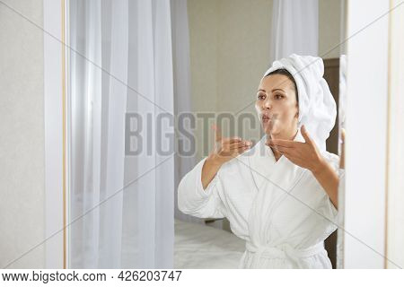 Young Woman Doing Facial Gymnastics Self Massage And Rejuvenating Exercises. Face Building For Skin 