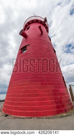 Red Poolbeg Lighthouse At Dublin Bay Entrance.