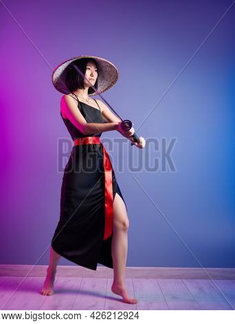 Slender Asian Woman An Asian Hat With A Katana In Her Hand Image Of A Samurai