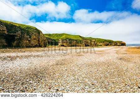 Sunny Cliffs and beach at Blackhall Rocks and Cromdon Dene Beach