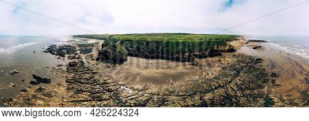 Sunny Cliffs and beach at Blackhall Rocks and Cromdon Dene Beach