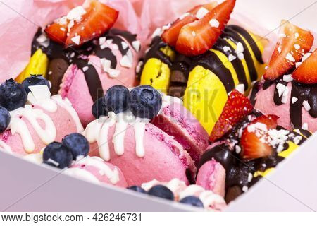 Traditional French Macaroons With Bluebarry And Strawberry. Colourful And Delicious Dessert With Cho