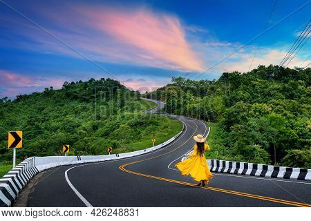 Woman Walking On Road No.3 Or Sky Road Over Top Of Mountains With Green Jungle In Nan Province, Thai
