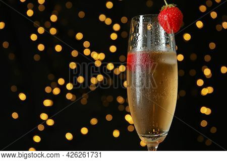 Concept Of Delicious Drink With Rossini Cocktail Against Dark Background With Blurred Lights