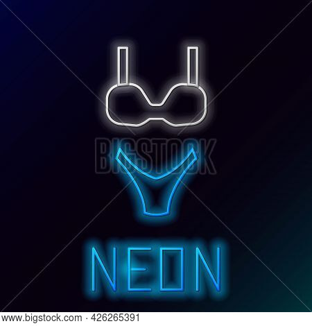 Glowing Neon Line Summer Beach Swimsuit Icon Isolated On Black Background. Beach Women Fashion. Colo