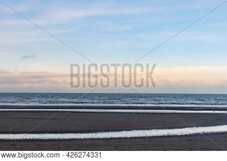 Oostduinkerke, Belgium - December 29, 2020: Abstract Seaxcape With Light Colors.