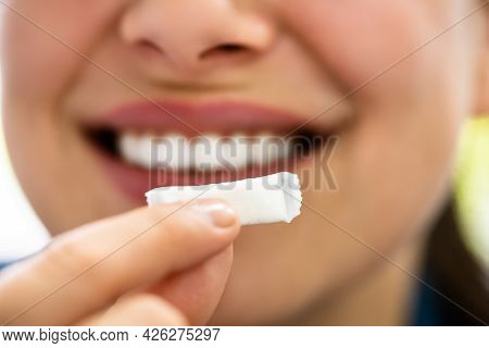 Woman Chewing Wet Moist Nicotine Tobacco Snus Product