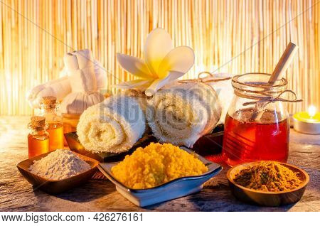 Fresh Organic Honey In Glass Bowl With Spa Salt, Turmeric Powder, Aroma Gel, Soft White Towl And Mas
