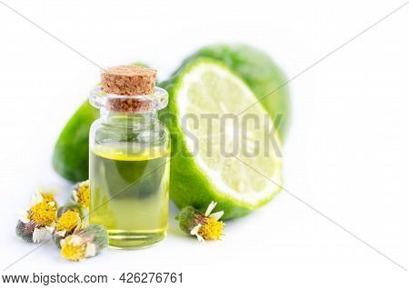 Bergamot Fruit Extract Aroma Gel In Glass Bottle Over Blur Fruit And Wil Grass Flower On White Backg