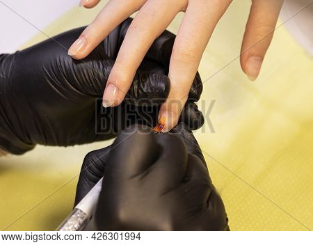 Coating Of Gel Polish On Nails With  Combined Manicure. Stage Of Work With Nail Base Coat