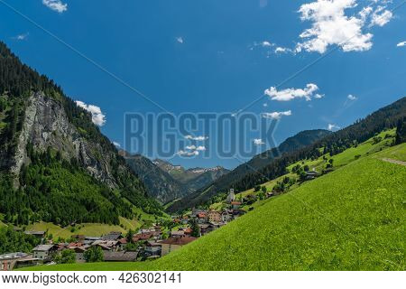 Summer Valley With Grossarler Ache Small River And Blue Cloudy Sky