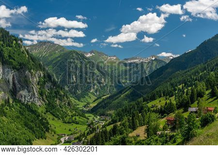 Summer Valley With Grossarler Ache Small River And Blue Cloudy Sky