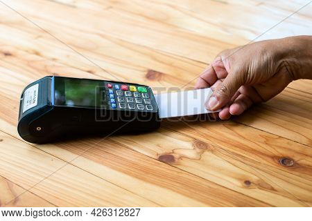 Selective Focus To Hand Put Credit Card In Slot Of Credit Card Reader, Credit Card Payment, Buy And