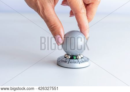 Hand Spinning The Wheel Of Opportunity, Pointer On Go For It, Accidental Luck Concept, Isolated