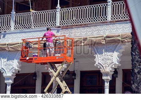 Torrevieja, Spain, 12.05.2021, Builder Doing Reconstraction Of Building, Painting Work