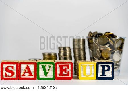 Money Coins Stack Stair As Step Growing Growth And Wooden Cube Block With Word Saveup. Investment An